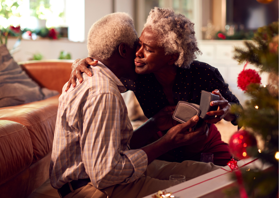 a couple giving each other gifts